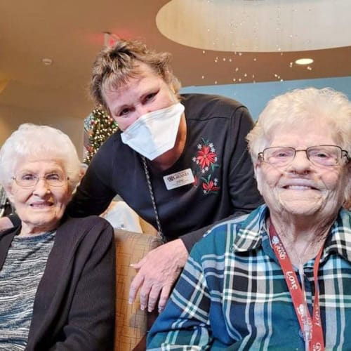 Team member with residents at The Oxford Grand Assisted Living & Memory Care in Wichita, Kansas