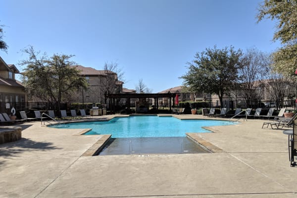 Pool area at Stone Lake Apartments in Grand Prairie, TX