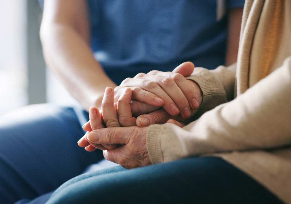 Caretaker comforting resident at Clearwater at Sonoma Hills in Rohnert Park, California