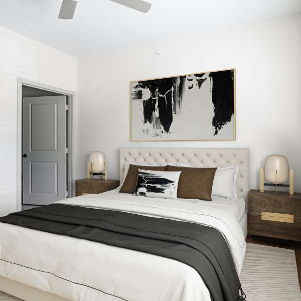 Modern bedroom with king size bed, ceiling fan and side table lamp at Echo Trail in Bowling Green, Kentucky