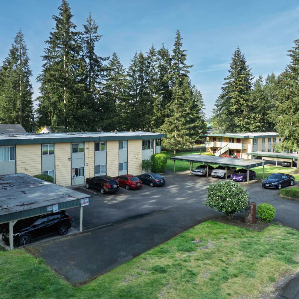View of apartment with parking area at Hawks Prairie Apartments in Lacey, Washington