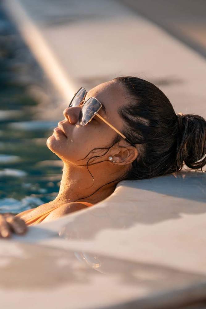 Resident by the pool at Crescent Apartments in Roseville, California