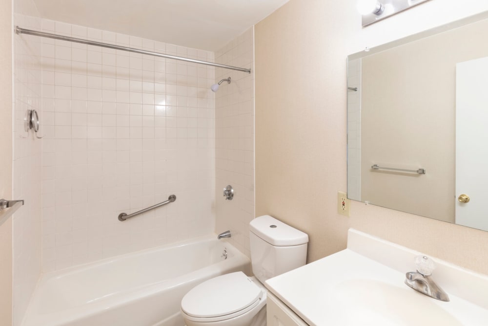 Bathroom with counter space and mirror at Eagle Rock Apartments at Framingham in Framingham, Massachusetts