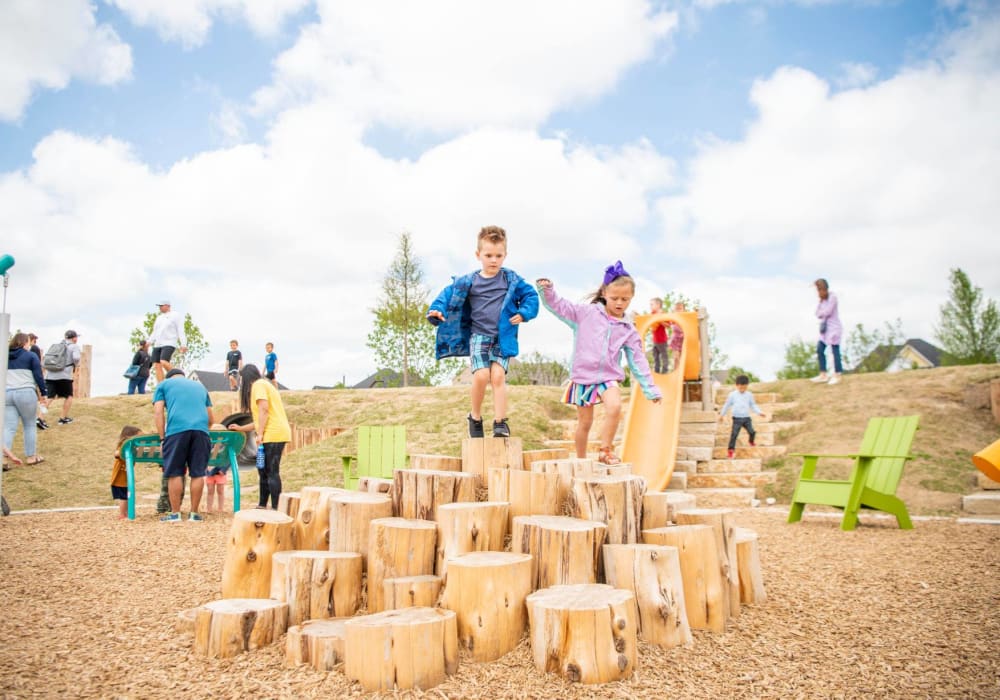 Kids playing at park at BB Living Harvest in Argyle, Texas