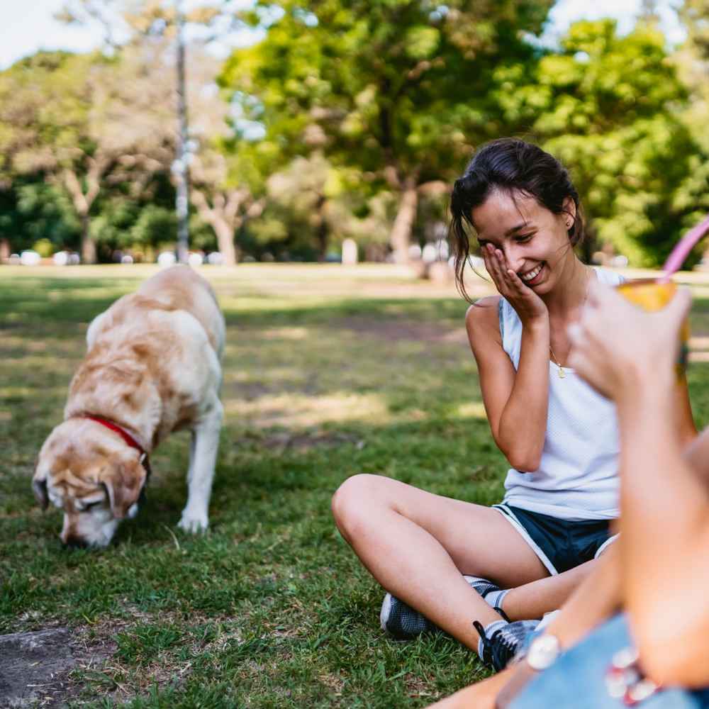 Resident and her puppy in a nearby park at The Anderson at Brooks in San Antonio, Texas