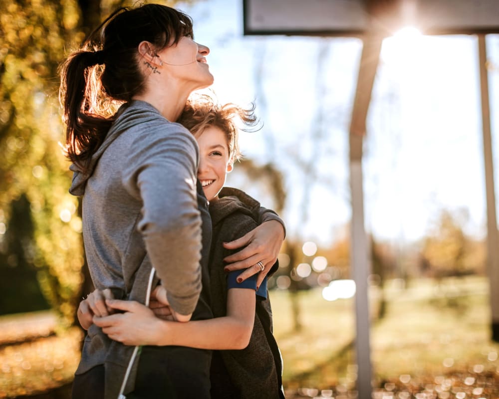 A mother hugging her son at Ben Moreell in Norfolk, Virginia