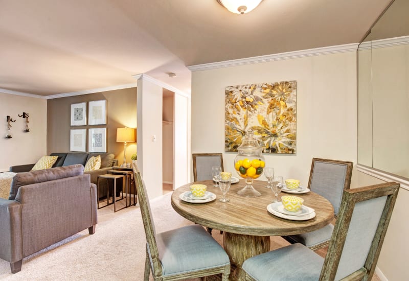 Dinning room adjacent to an open living room area at The Hamptons at Town Center in Germantown, Maryland