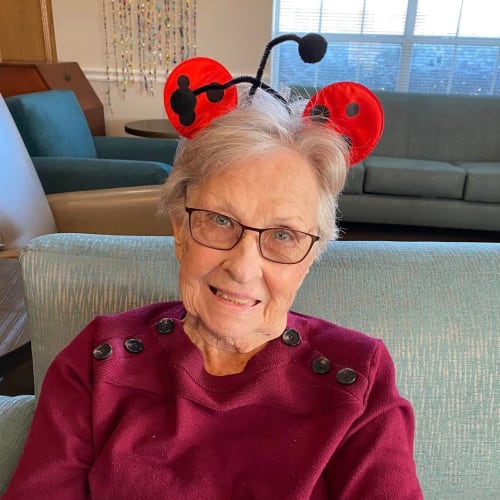 A resident holding candy bags at Canoe Brook Assisted Living in Ardmore, Oklahoma