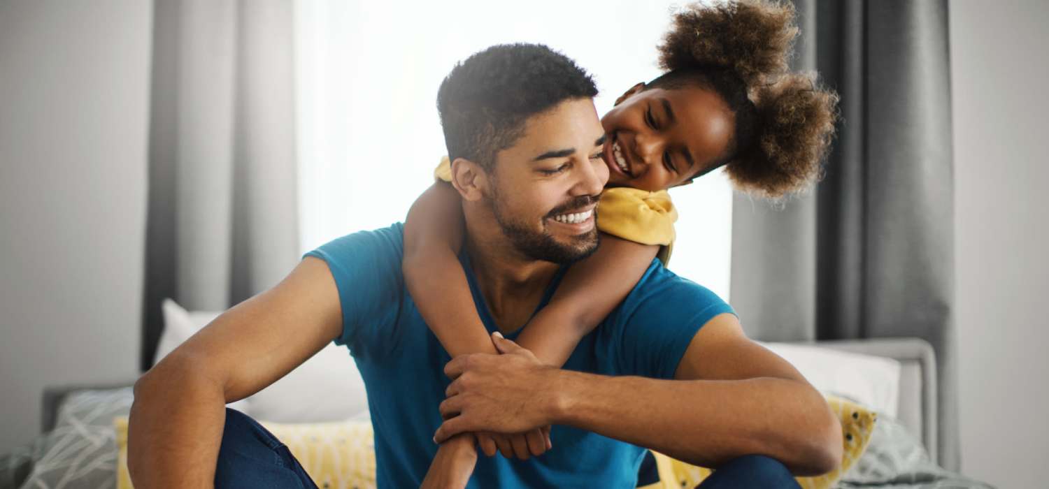 Happy parent and child in a home at Old Hundred Trace Apartments in Midlothian, Virginia