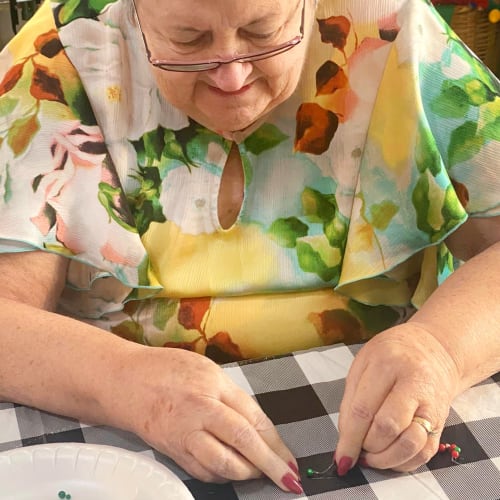 A resident crafting at Canoe Brook Assisted Living in Ardmore, Oklahoma