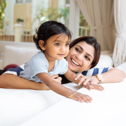 A mother smiling at her daughter at The Village at Whitehurst Farm in Norfolk, Virginia