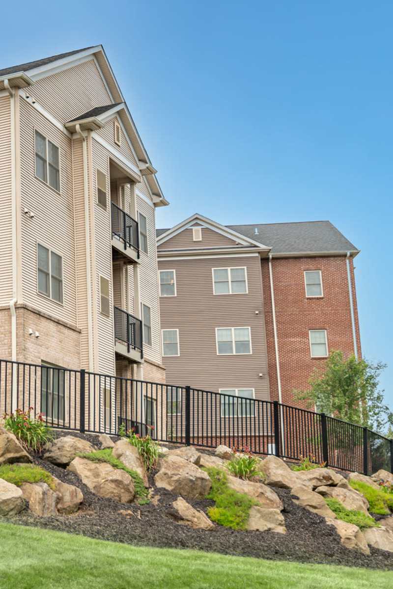 Exterior of Rochester Village Apartments at Park Place on a sunny spring day in Cranberry Township, Pennsylvania