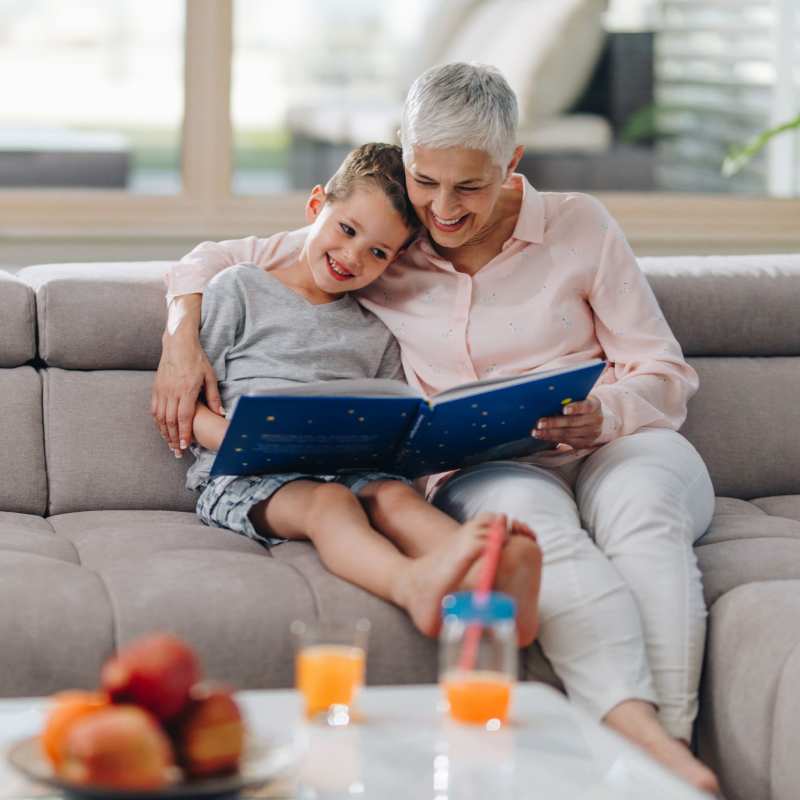 A resident reads with her grandson at Acclaim at Cary Pointe, Cary, North Carolina