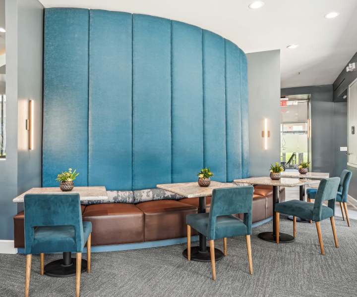 Community seating area with chairs and tables at Archer Medical District in Dallas, Texas
