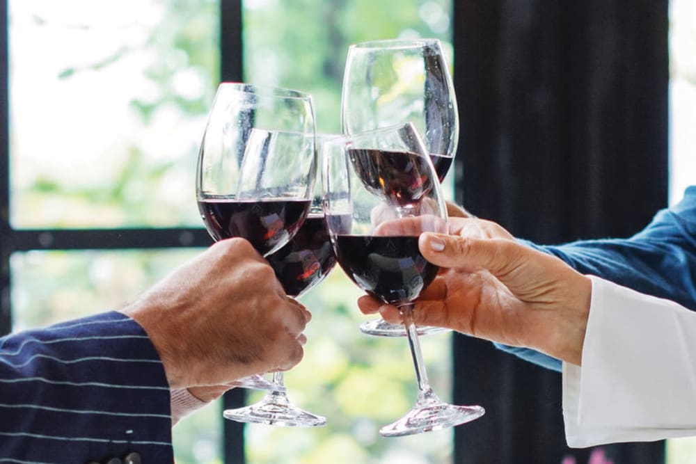 Toasting with red wine at The Wentworth at East Millcreek in Salt Lake City, Utah