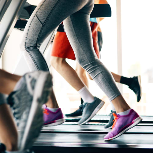 Residents running on treadmills at the fitness center at  16 Powerhouse Apartments in Sacramento, California