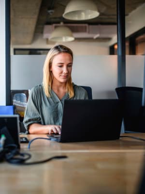 A woman on her computer at her job near Haven Hills in Vancouver, Washington