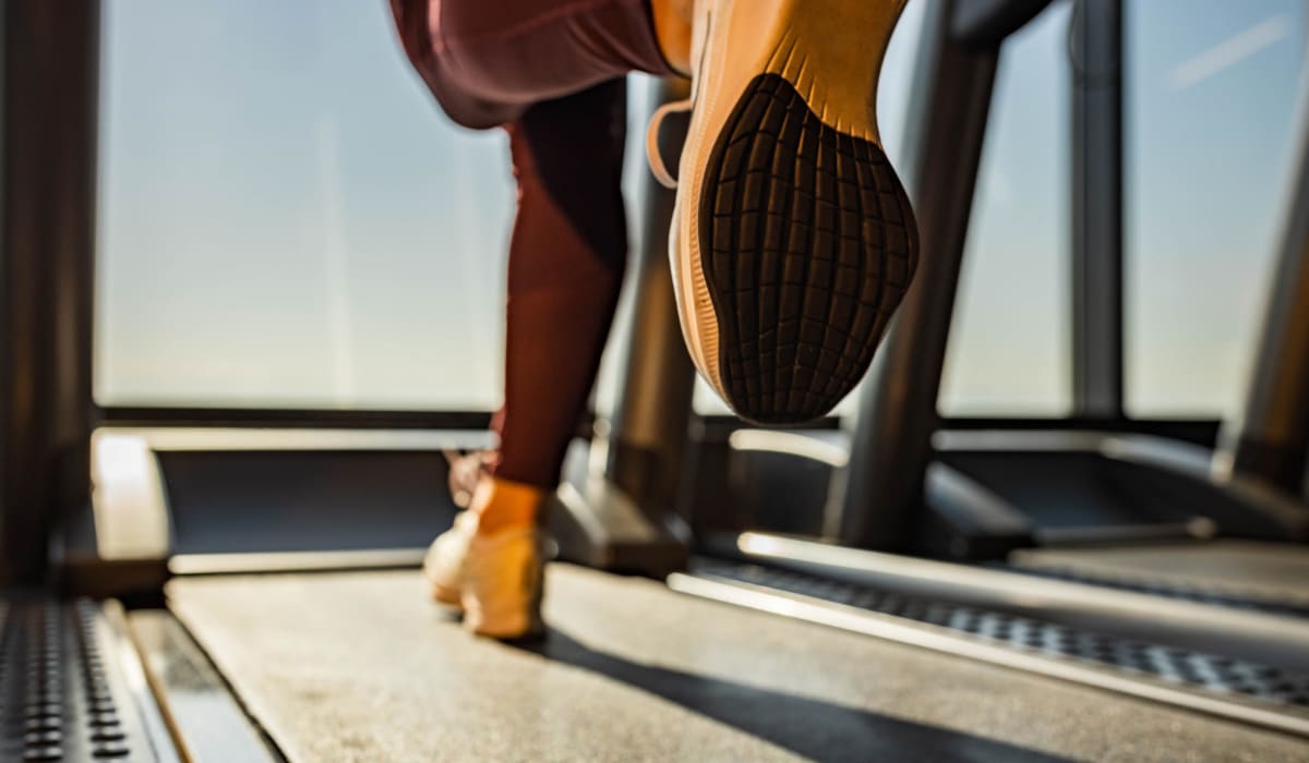 Person running on the treadmill at The Collection Townhomes in Dallas, Texas