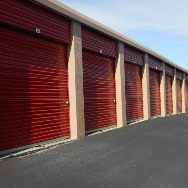 Outdoor storage units with red doors at StorQuest Self Storage in Sarasota, Florida