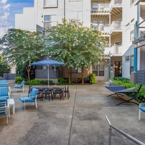 Hammock and lush flora at one of the common area courtyards at Olympus Midtown in Nashville, Tennessee
