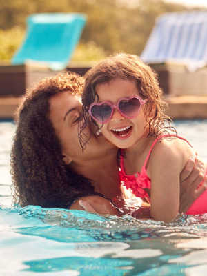Mother and daughter swimming in pool at Lakeview in Reno, Nevada