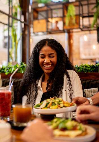 Resident having dining at a restaurant near Parkridge Apartments in Durant, Oklahoma