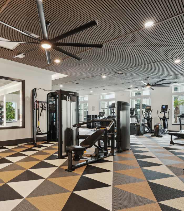 Resident working out in the gym at The Southerly at Orange City in Orange City, Florida