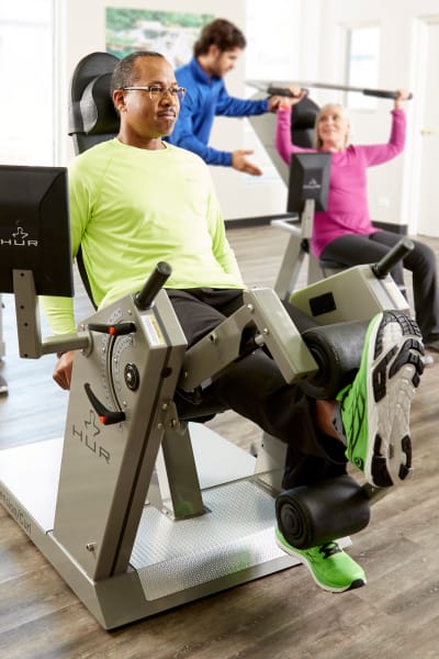Residents using the workout machines at Quail Park of Oro Valley in Oro Valley, Arizona