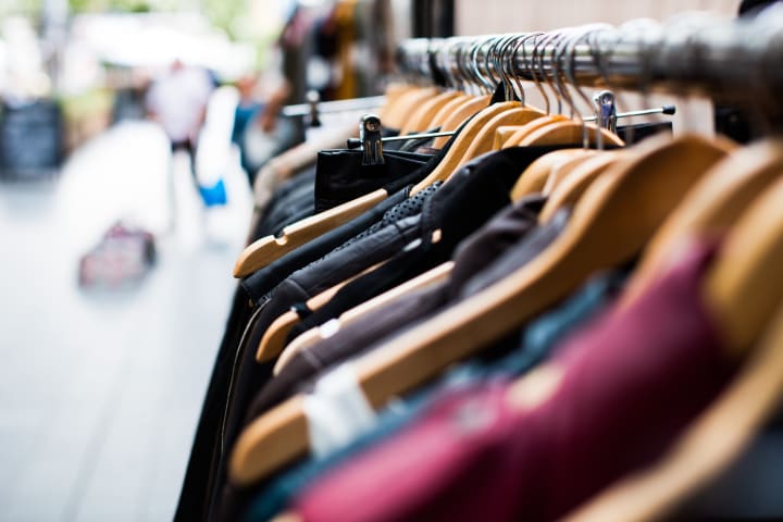 clothes hanging up on a rack