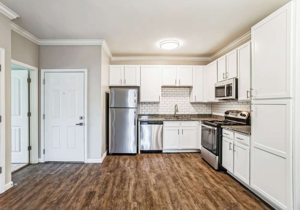 Modern Kitchen and Empty Dining at Carroll at Cane Ridge Apartments in Antioch, Tennessee