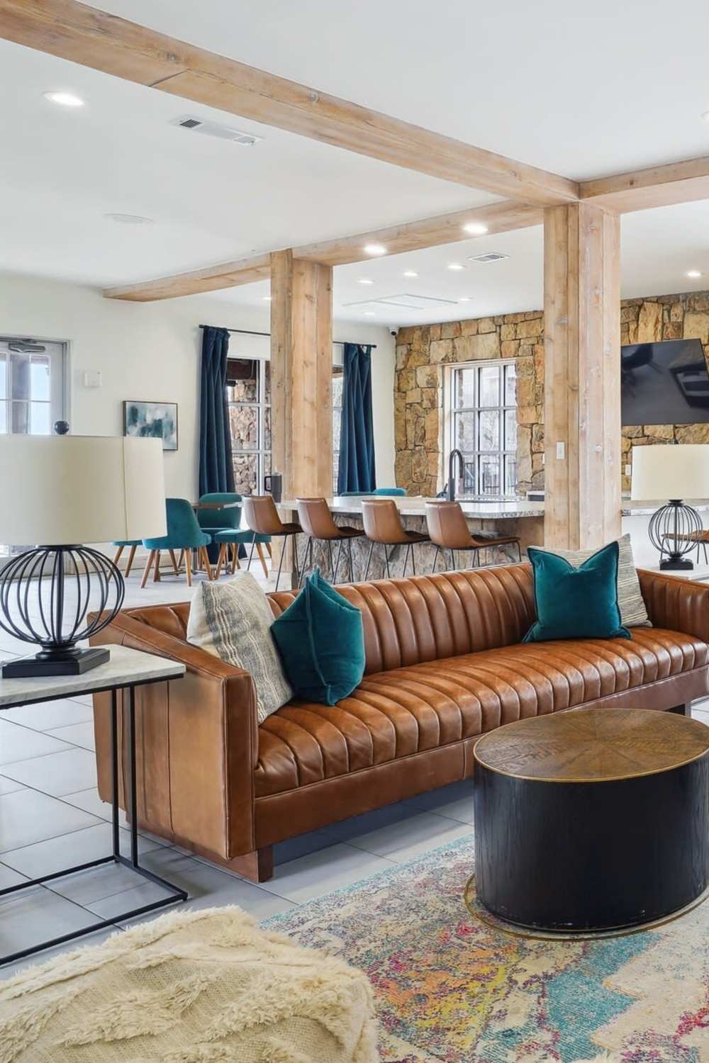 Clubhouse with plush couch and lots of seating area at Flatiron District at Austin Ranch, The Colony, Texas