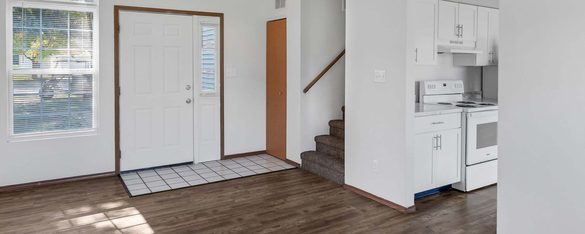 Living room with hard-wood flooring at Meadowlark Townhomes in Dekalb, Illinois