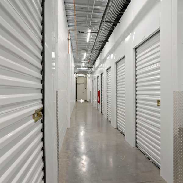 Indoor storage units with red doors at StorQuest Self Storage in El Cajon, California