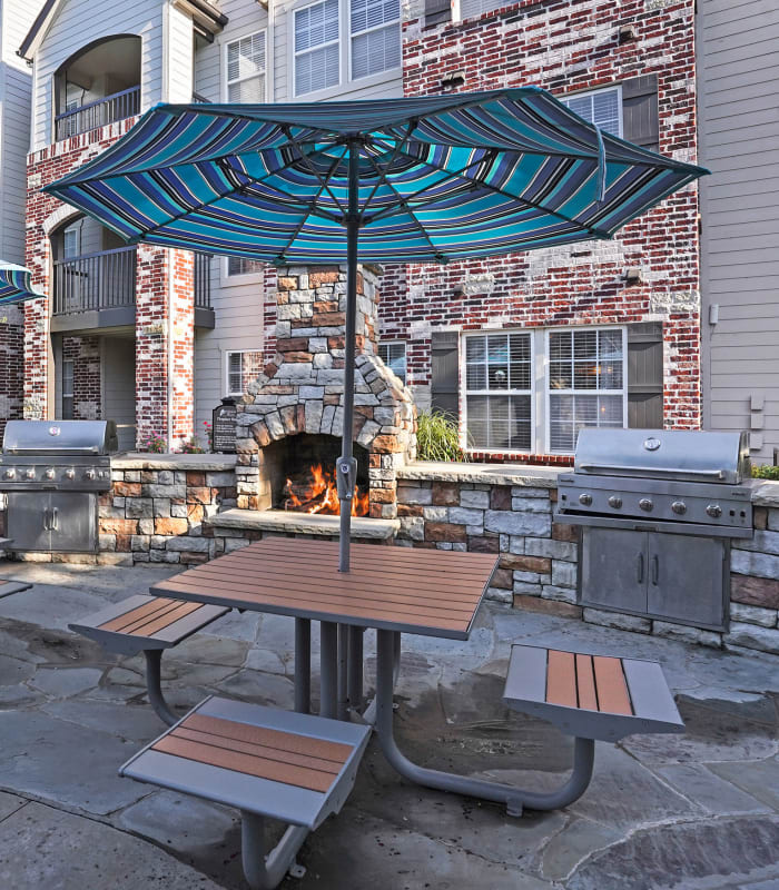 The Outdoor umbrella patio seating at Park at Mission Hills in Broken Arrow, Oklahoma