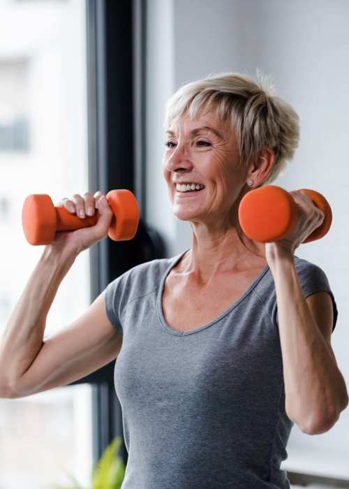 Paved walkway in a beautiful and lush environment at Tuscan Gardens of Venetia Bay in Venice, Florida