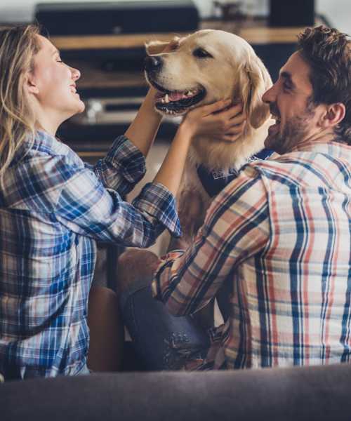 Residents playing with pet dog at Deering Manor in Richmond, Virginia