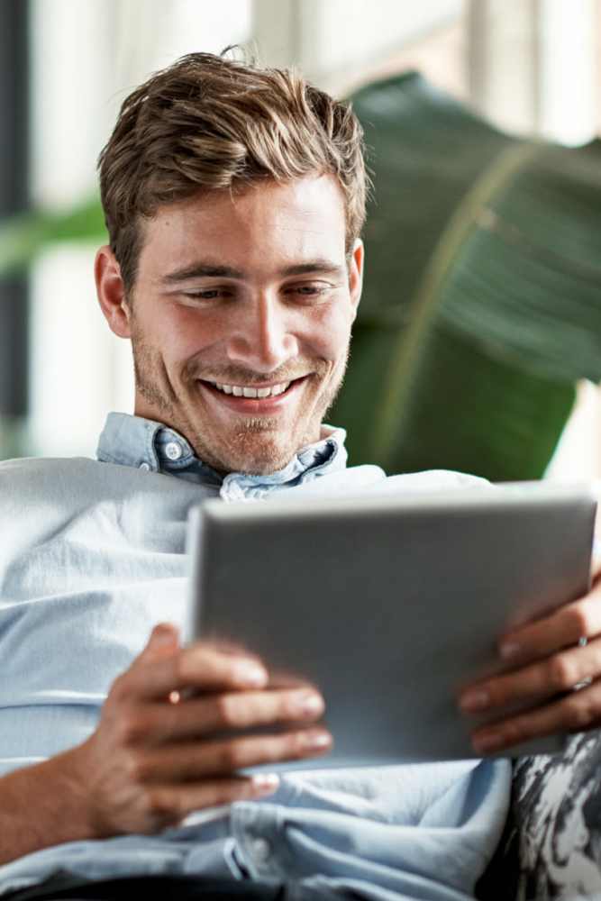 Resident utilizing high-speed internet services from the comfort of his apartment at Villa De Oro in San Antonio, Texas
