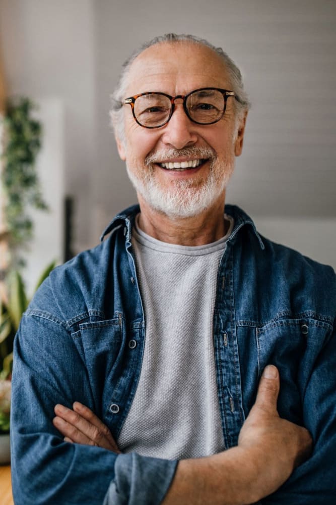 Resident smiling for the camera at Coeur D'Alene Plaza in Spokane, Washington