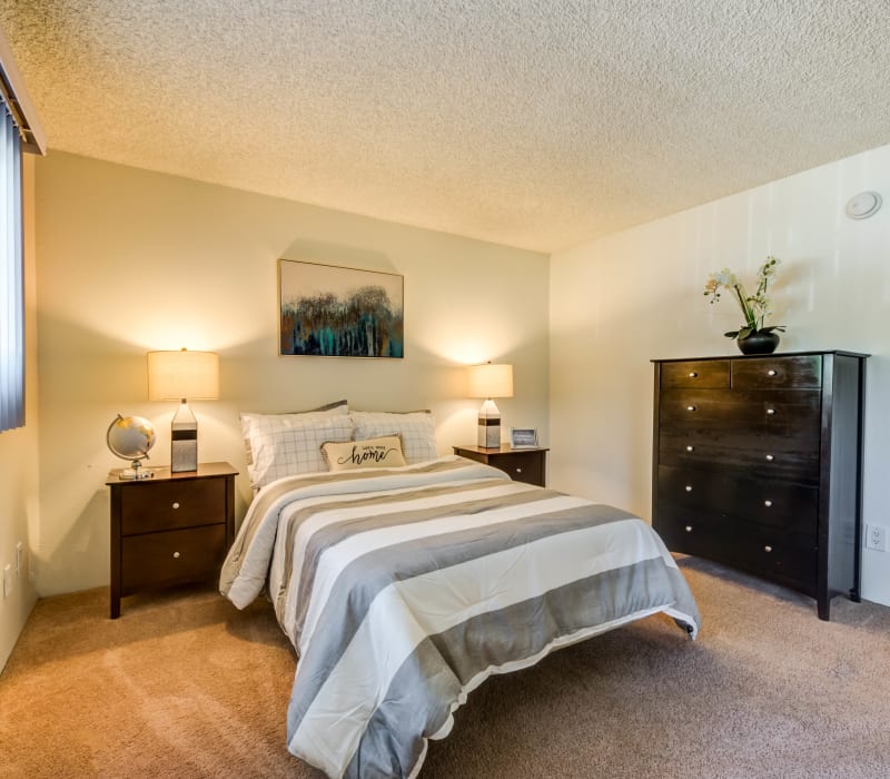 A spacious carpeted bedroom at Cypress Point in Northridge, California