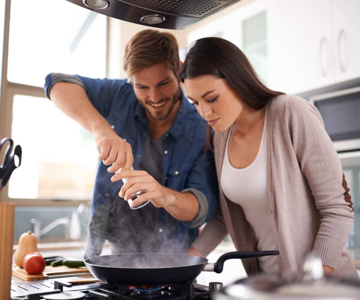 Couple preparing meal in their kitchen at Savannah House of Guthrie in Guthrie, Oklahoma