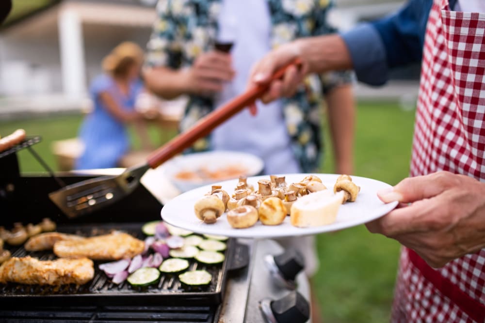 Resident grilling at Liberty Pointe in Newark, Delaware