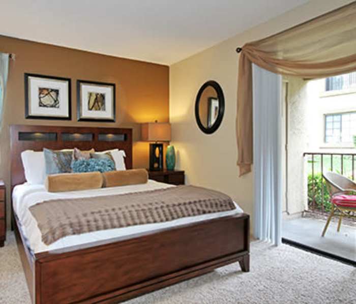 Bedroom with attached balcony at Mirada at La Jolla Colony in San Diego, California