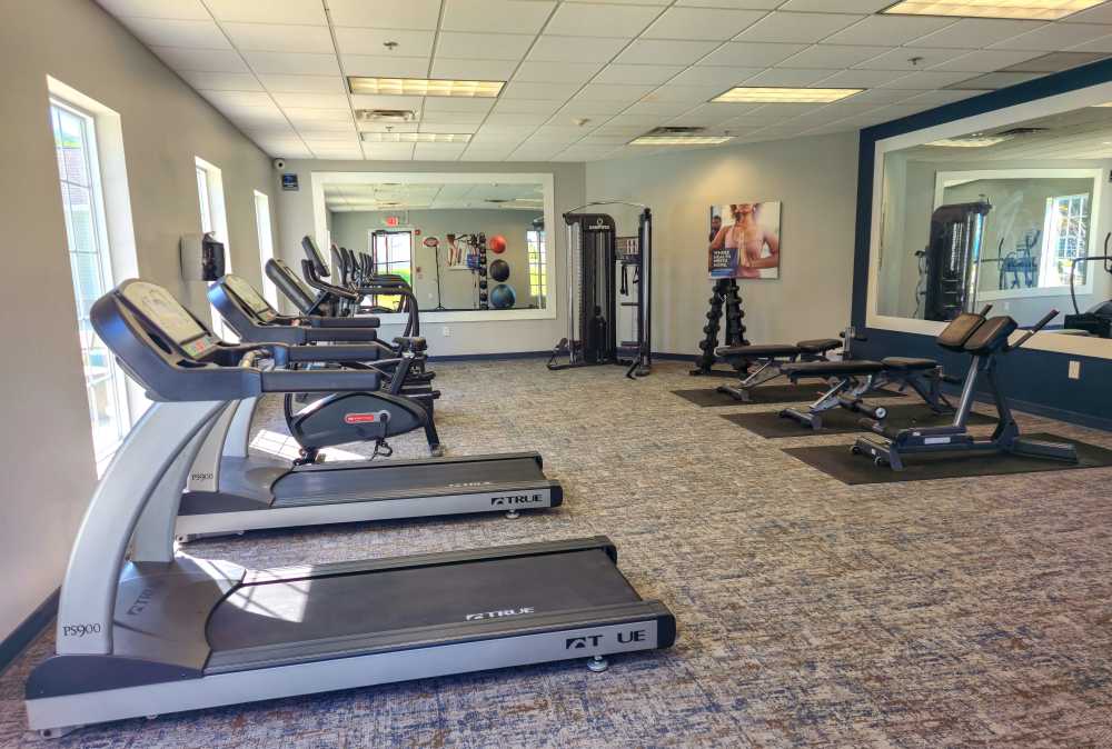 Well-equipped fitness center with cardio equipment at Jackson Grove Apartment Homes in Hermitage, Tennessee
