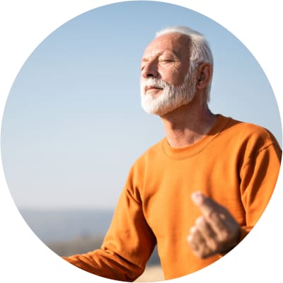Resident sitting cross-legged doing yoga at The Spring at Silverton in Fort Worth, Texas