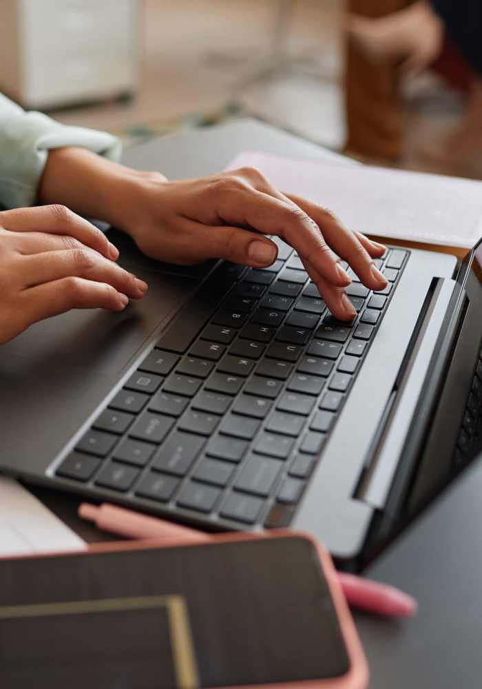 Resident on computer at College Town Mankato in Mankato, Minnesota