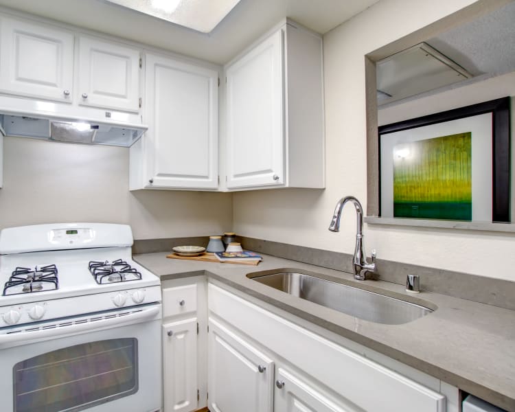 Modern kitchen with a breakfast bar in a model home at Vue Fremont in Fremont, California