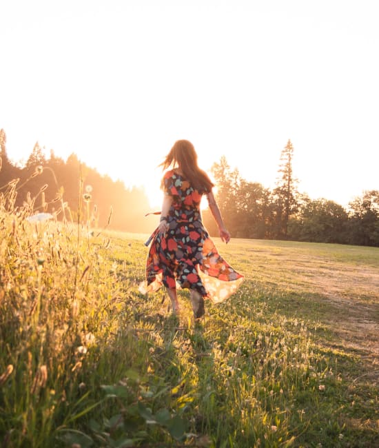 Cute photo of a girl out in a field with a summer dress on near Big Sky Flats in Washington, District of Columbia