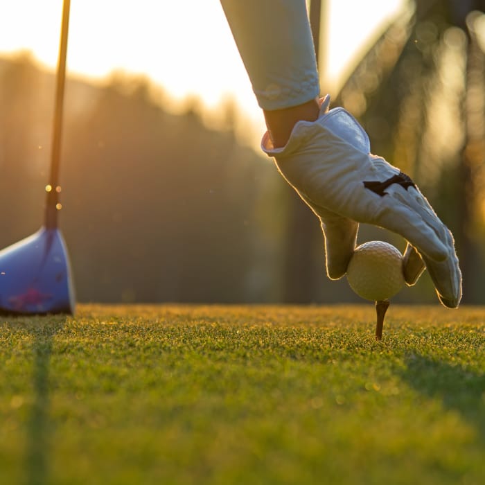 Resident teeing up for a round of golf near The District at Scottsdale in Scottsdale, Arizona