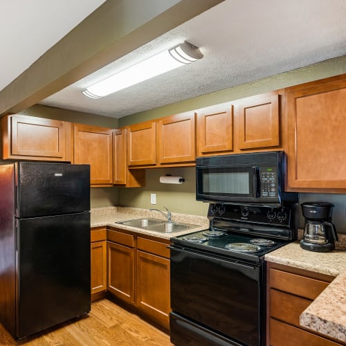 Well-appointed model kitchen at Monroe Terrace Apartments in Monroe, Ohio