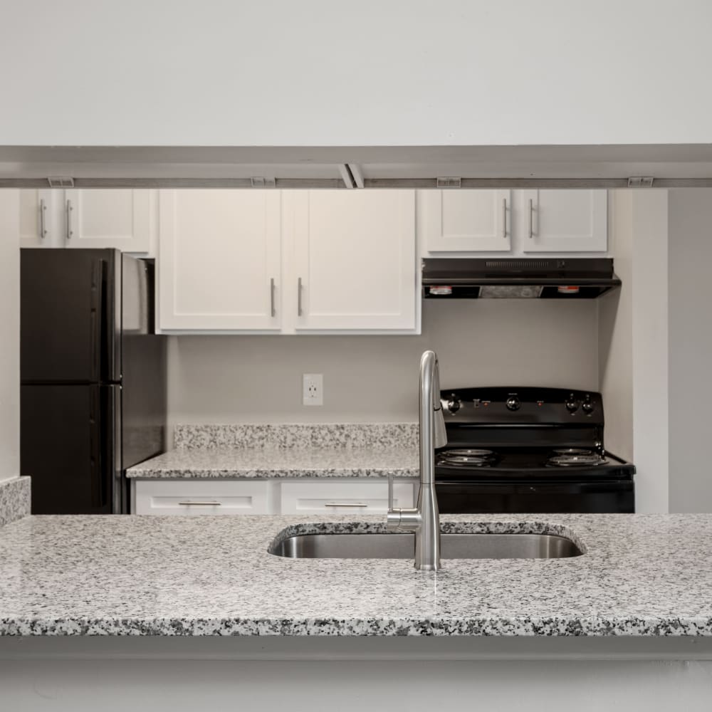 Granite countertops in an apartment kitchen at The Villages at West Laurel in Richmond, Virginia